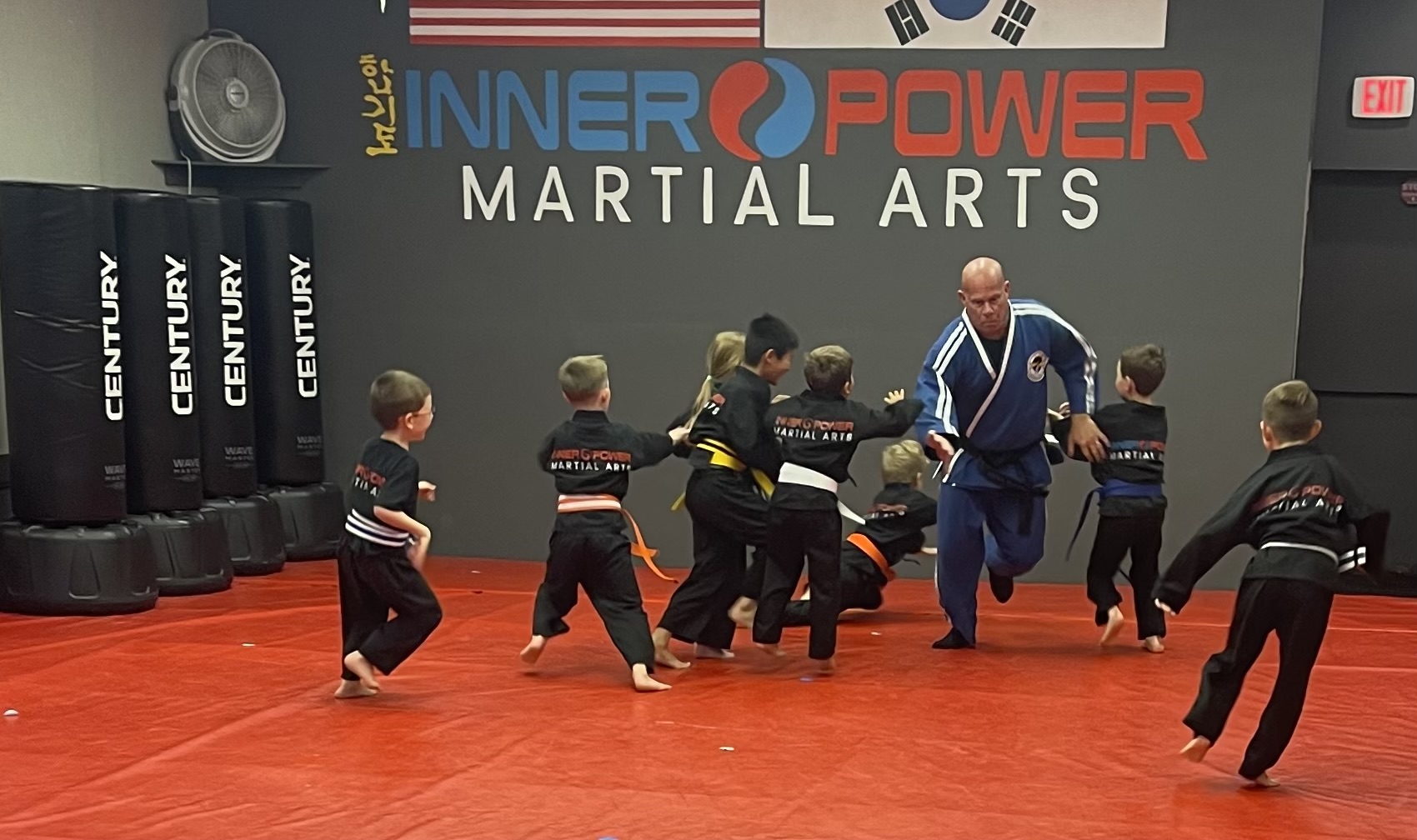 Kids charging at Master Brian during class